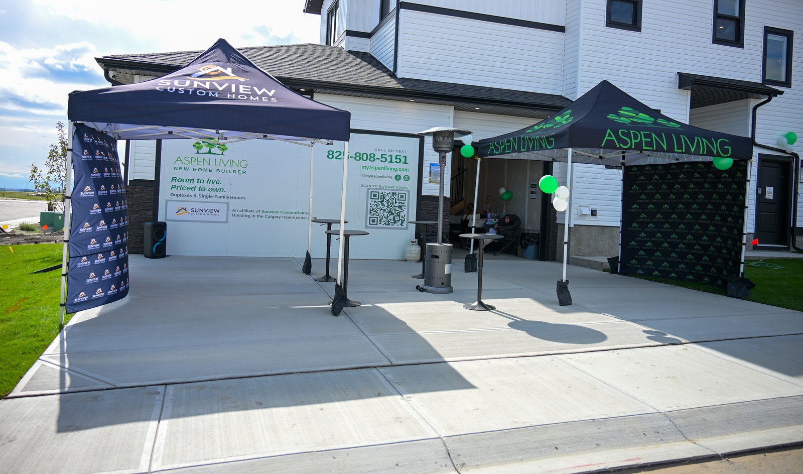 Welcome tents and signage at the front of the Aspen Living showhome