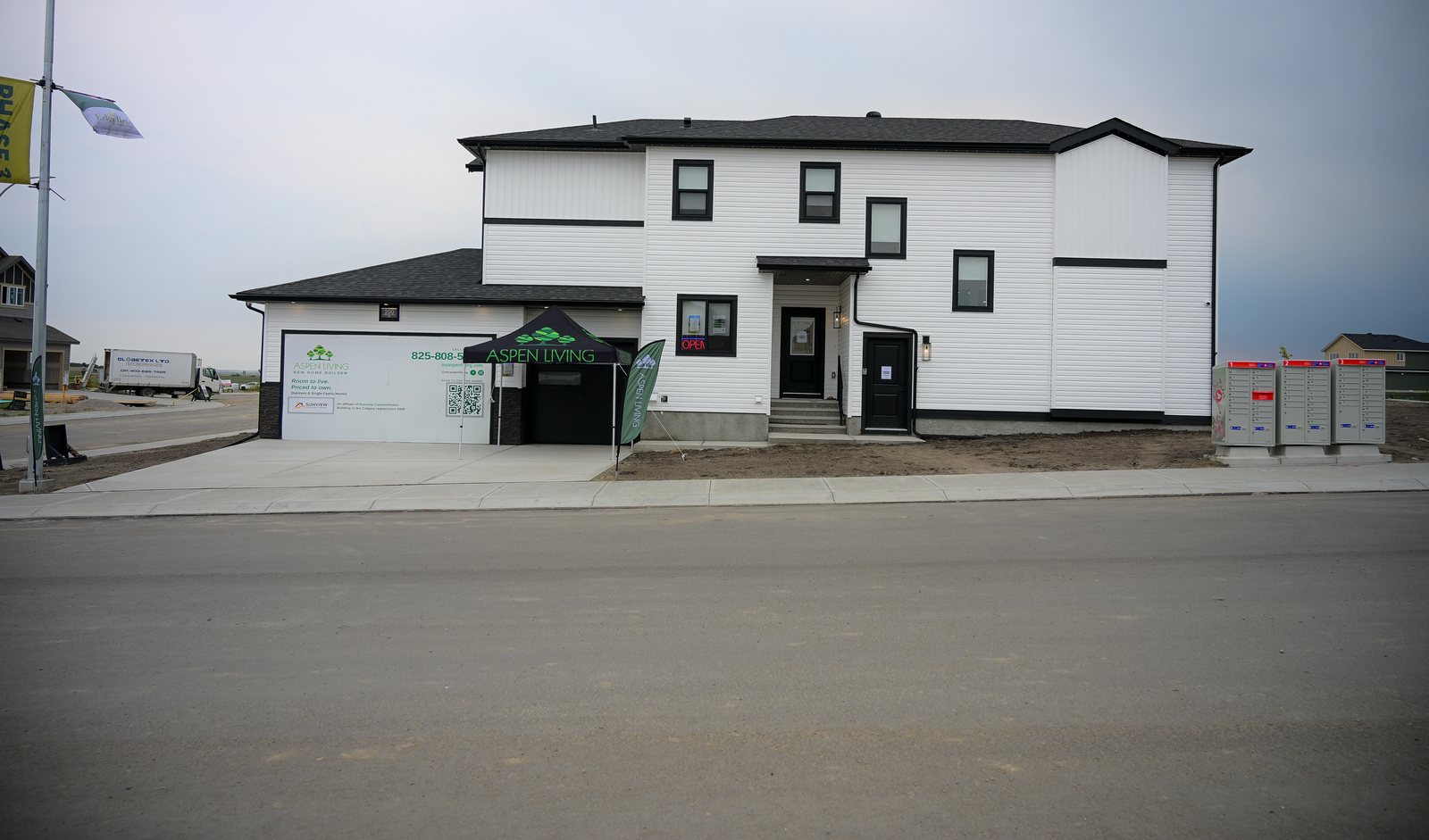 Aspen Living showhome at 200 Edgefield Bay, Strathmore, with the Aspen Living tent out front on the day of the realtor event