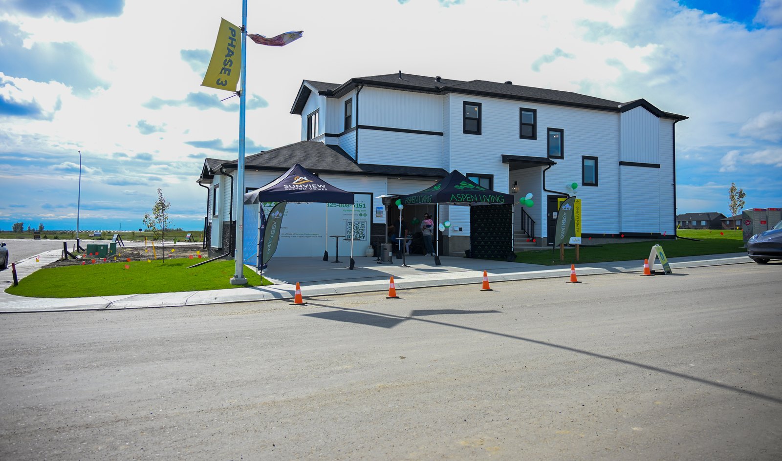 Aspen Living showhome at 200 Edgefield Bay, Strathmore, on opening day with the Aspen Living tent out front