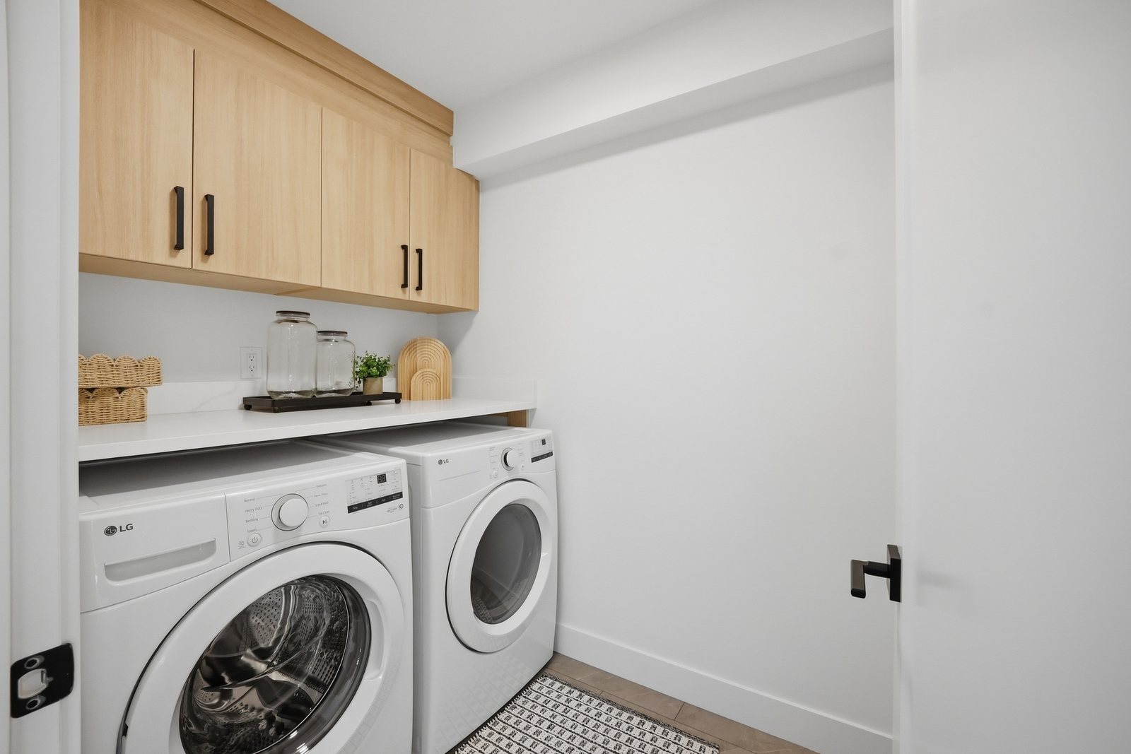 Upstairs laundry room in the Aspen Living showhome, 200 Edgefield Bay