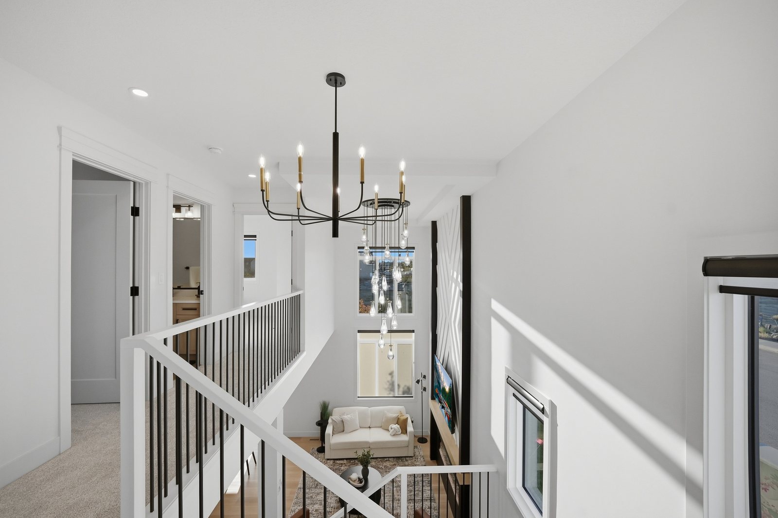Upper hallway looking down into the great room in the Aspen Living showhome, 200 Edgefield Bay