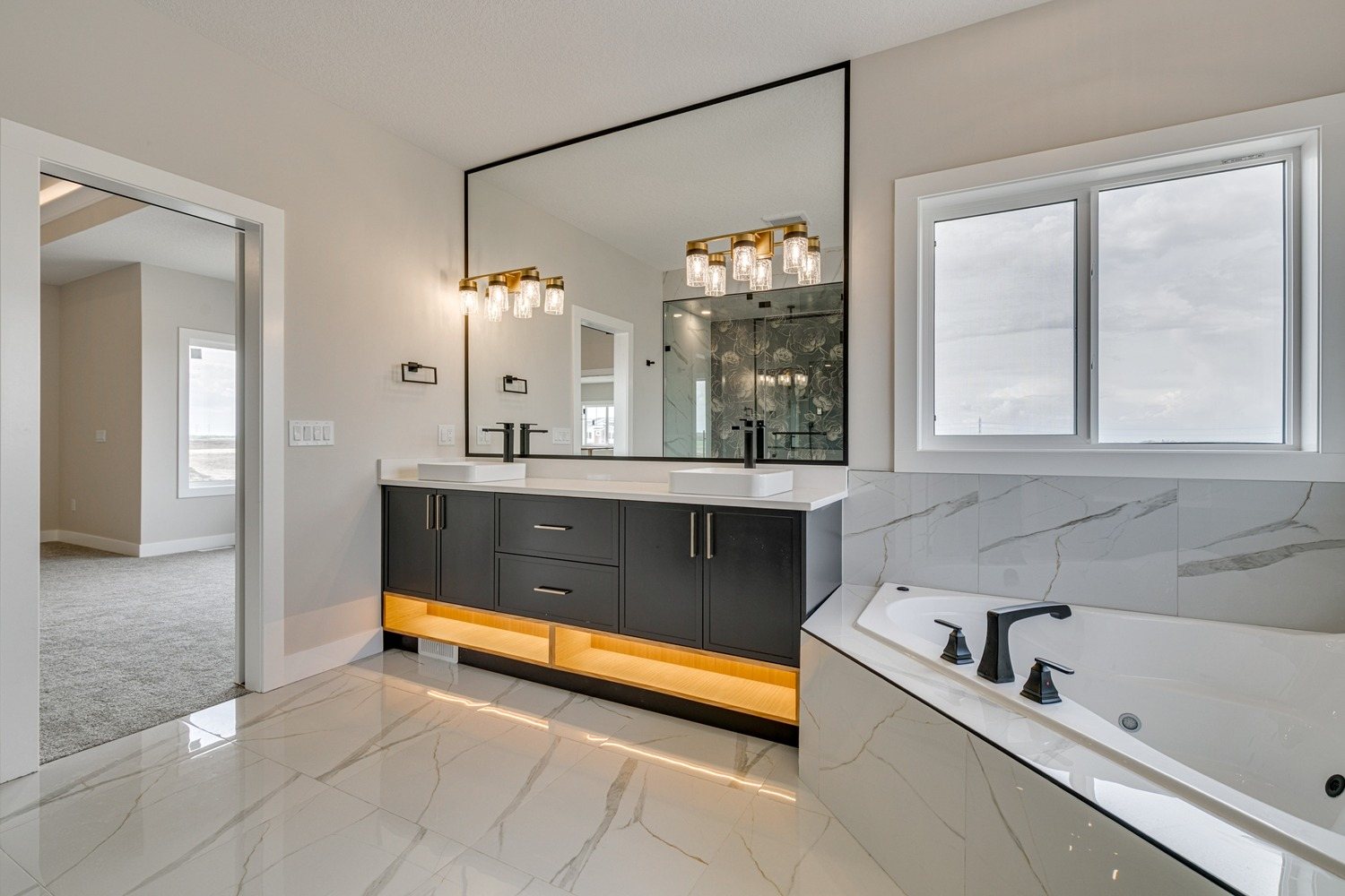 Ensuite with double vanity and soaker tub in a Waterford Estates home by Aspen Living