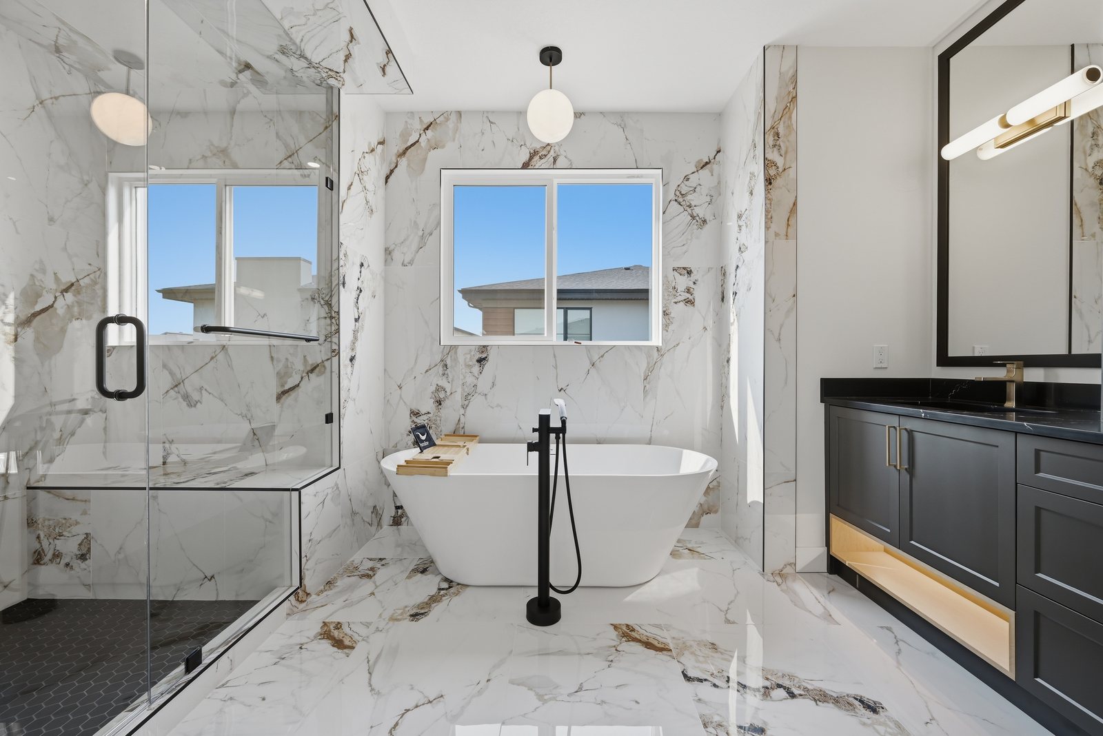 Marble-look ensuite with freestanding tub in a Waterford Estates home by Aspen Living