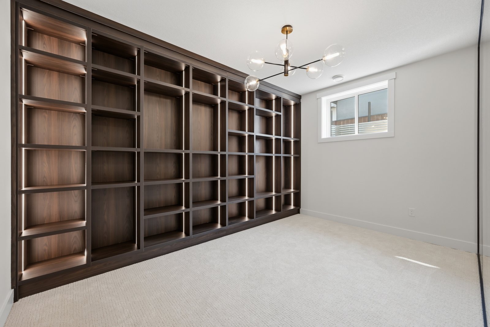 Floor-to-ceiling built-in shelving in a Waterford Estates home by Aspen Living